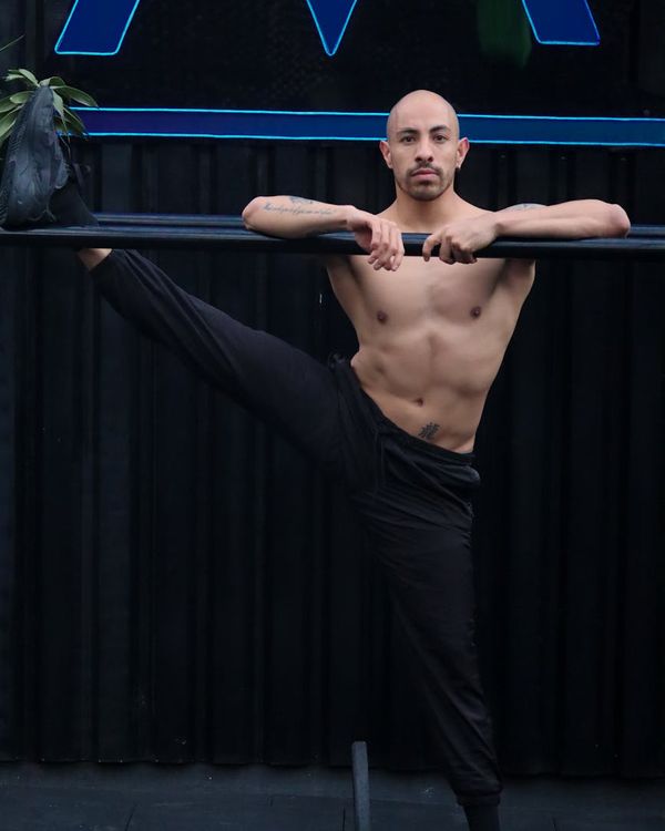 Man in a power stance demonstrating physical control and balance.